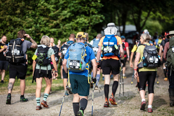 Runners setting off on an endurance race through woodland